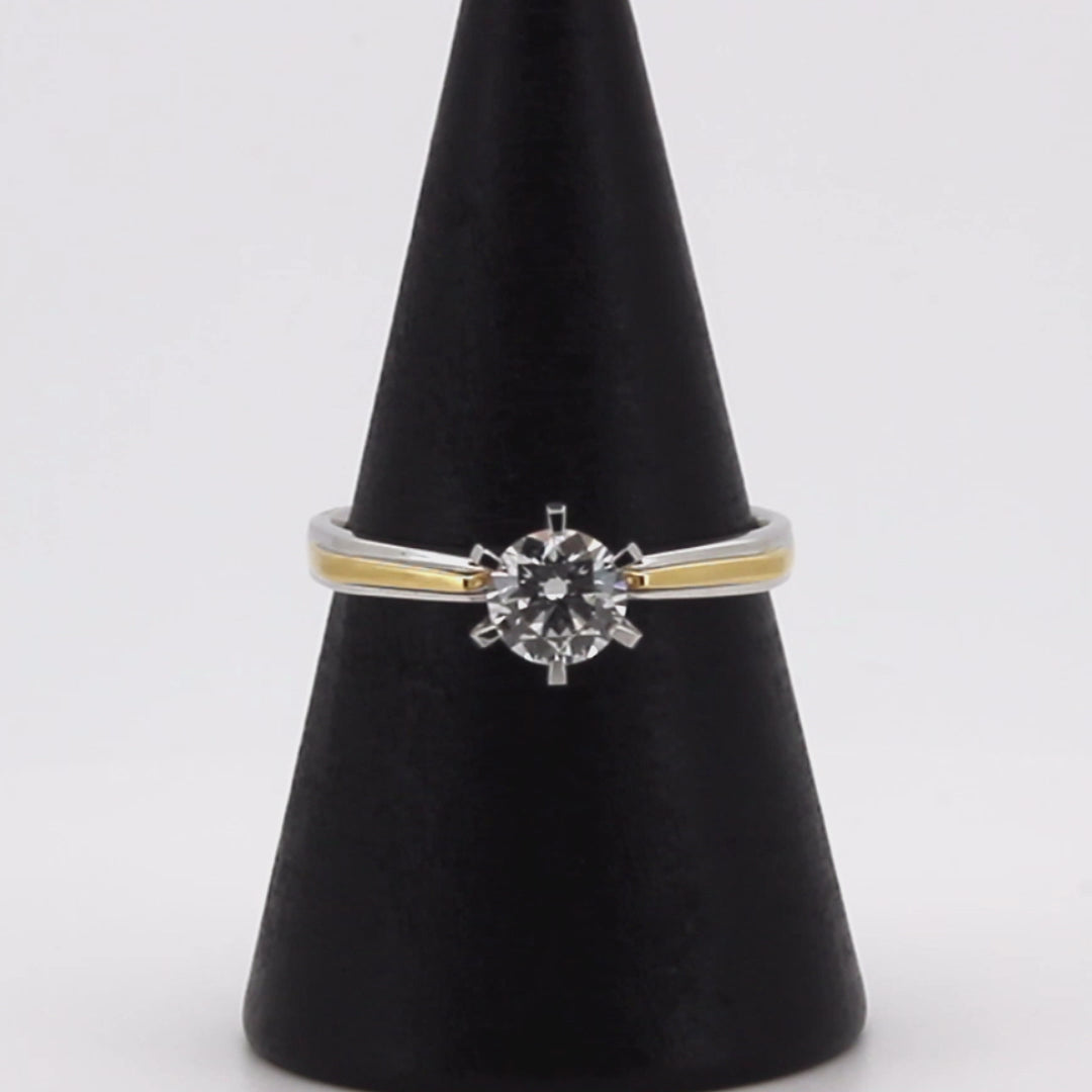 Video showcasing a stunning two-tone diamond engagement ring in 18K solid gold, featuring a brilliant solitaire diamond with ethically sourced lab-grown diamonds. The ring is perfect for engagement or gifting, offering elegance and superior craftsmanship.